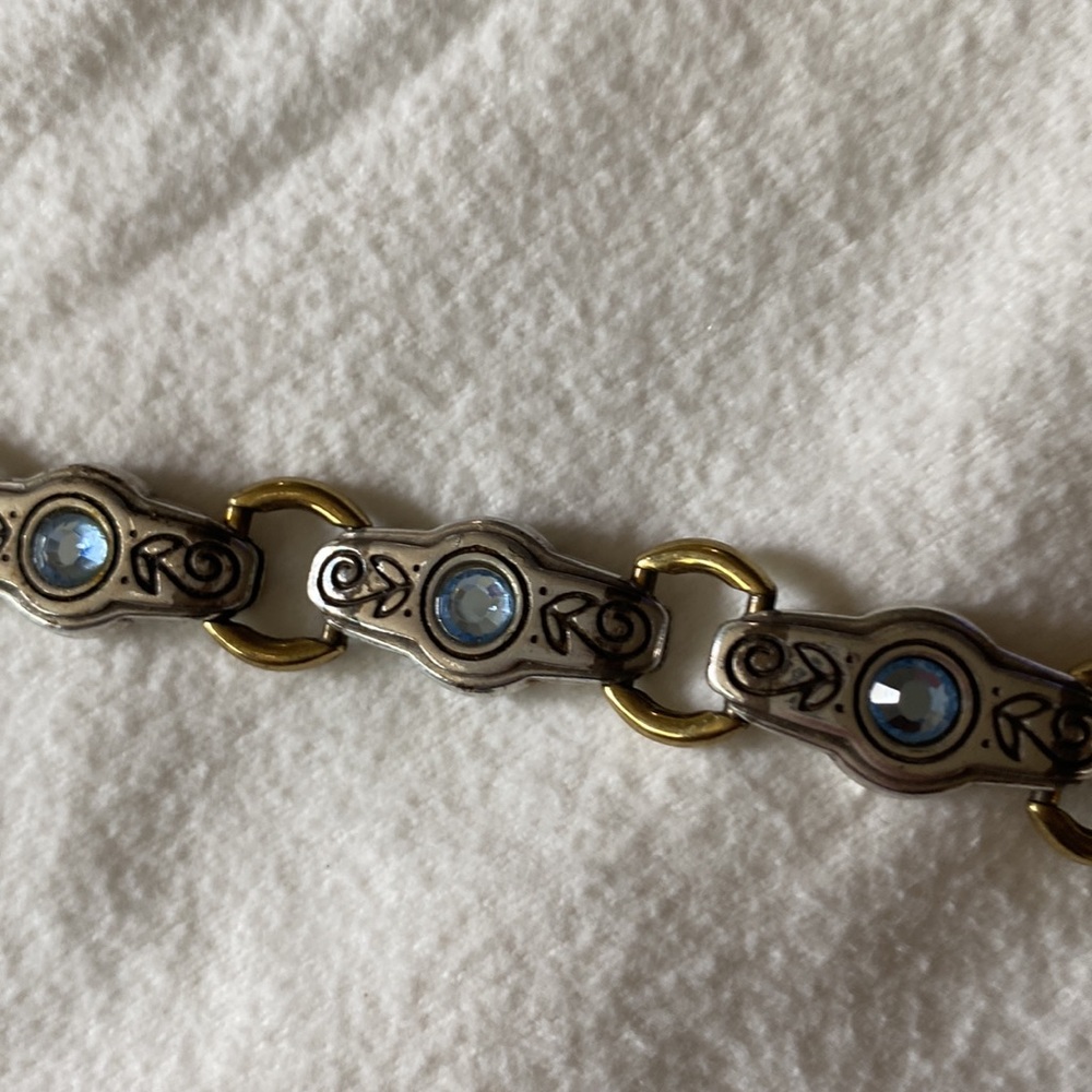 Brighton bracelet with blue stones, silver etching and gold loops